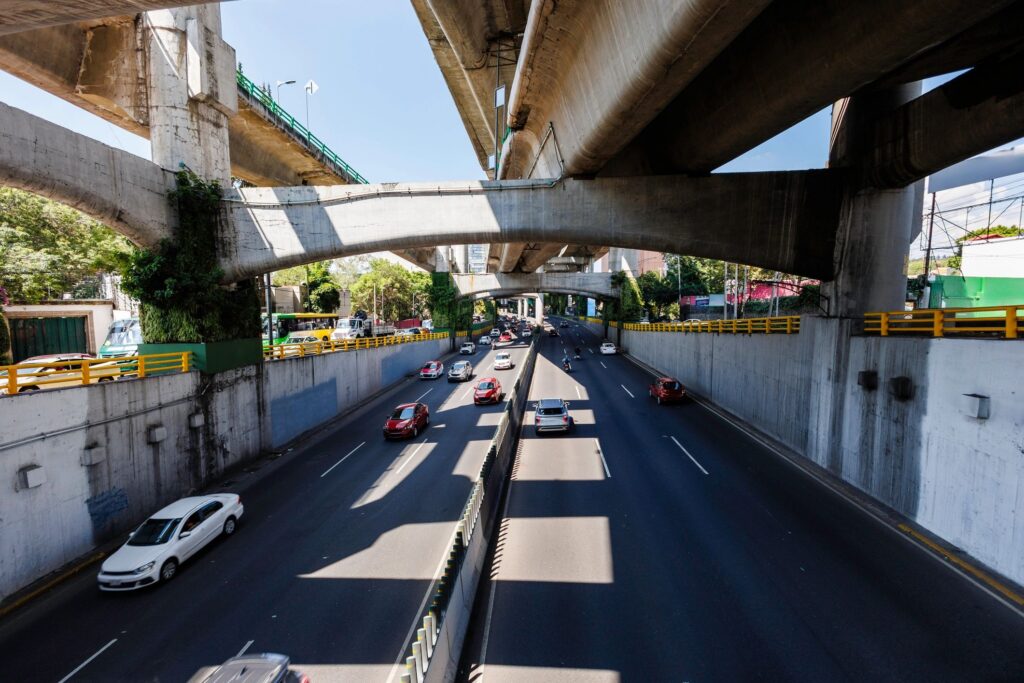 Morning commuters at Boulevard Periferico, south of Mexico City under elevated highway